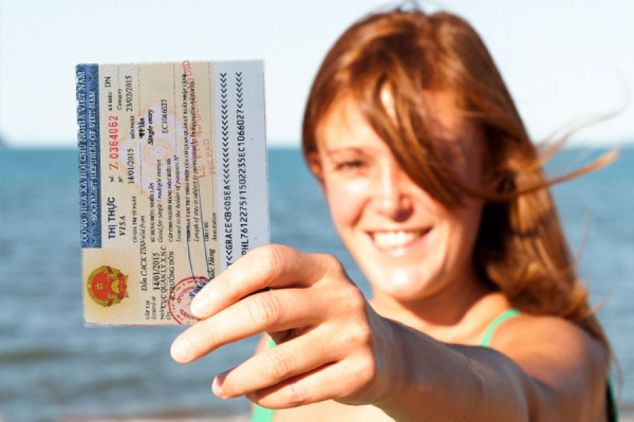 UK Girl holding the Vietnam Visa