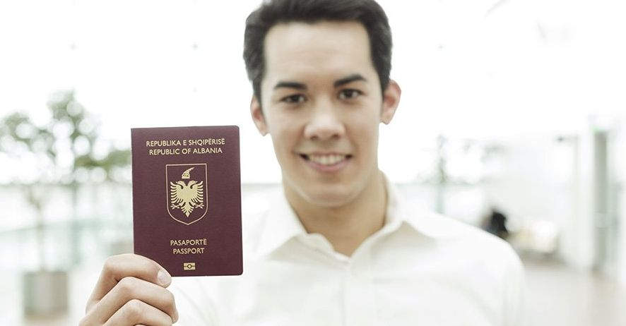 Man holding the Albamia passport