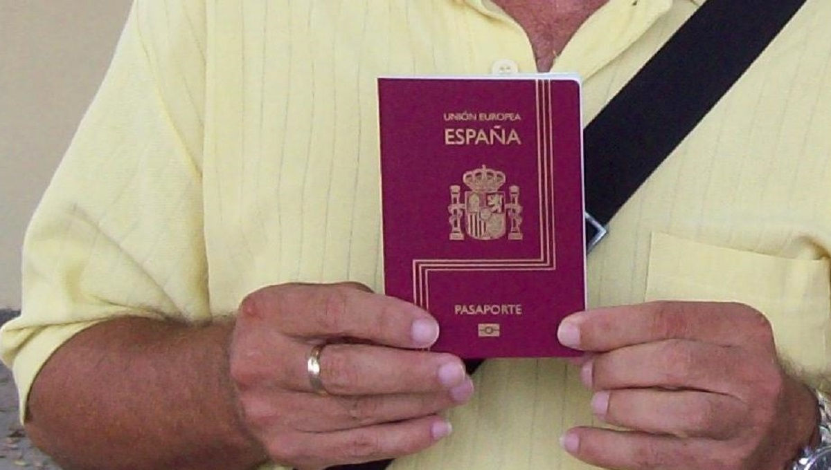 Man holding the passport by his hands