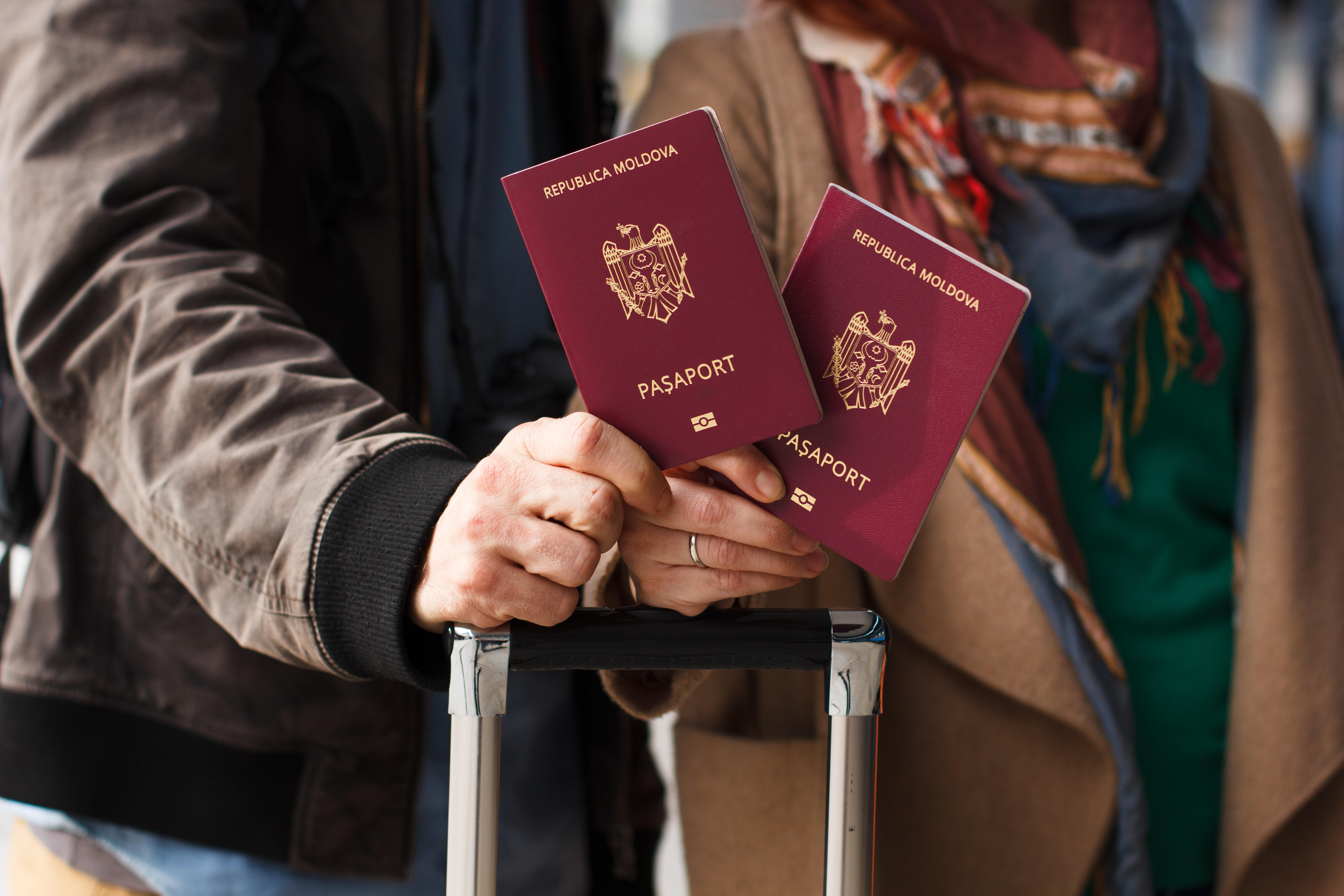 Couples holding Moldova Passport along with their Luggaes