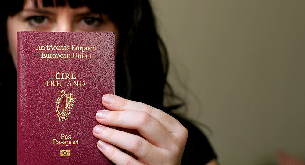Girl holding the Ireland passport