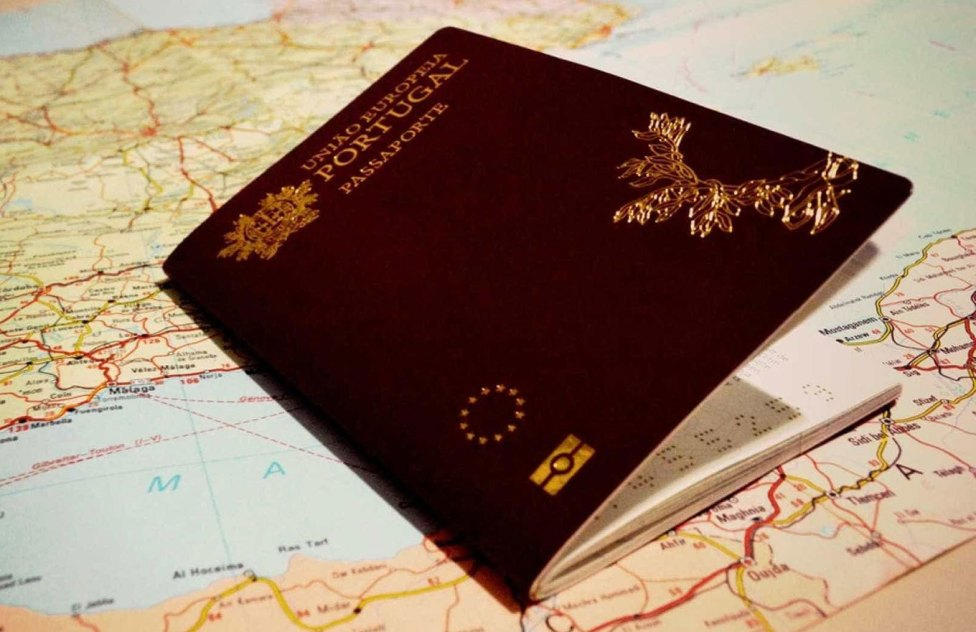 Portugal passport placed on the Map
