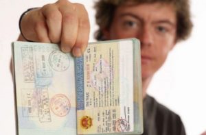 Man showing vietnam visa for Romania citizen