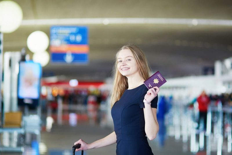 Women with passport in Airport